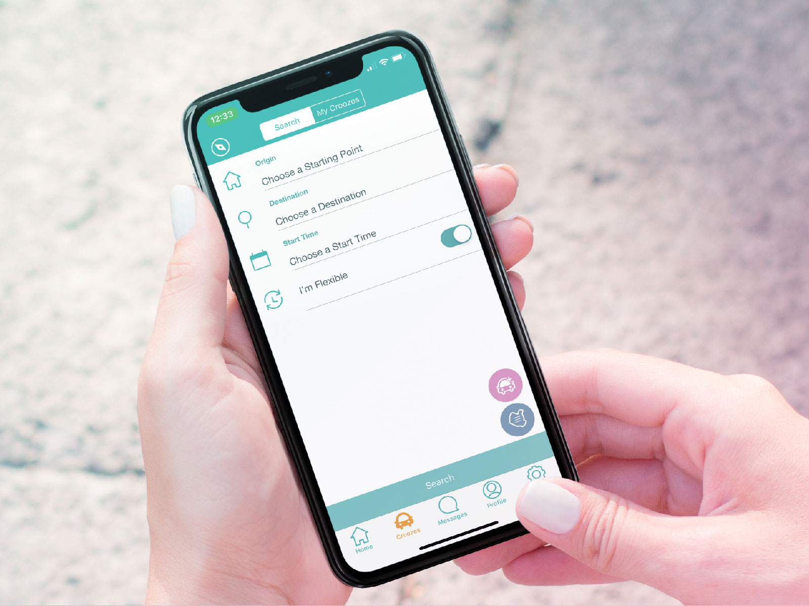 Hands holding a phone with the Croozen search screen, asking for an origin, destination and start time