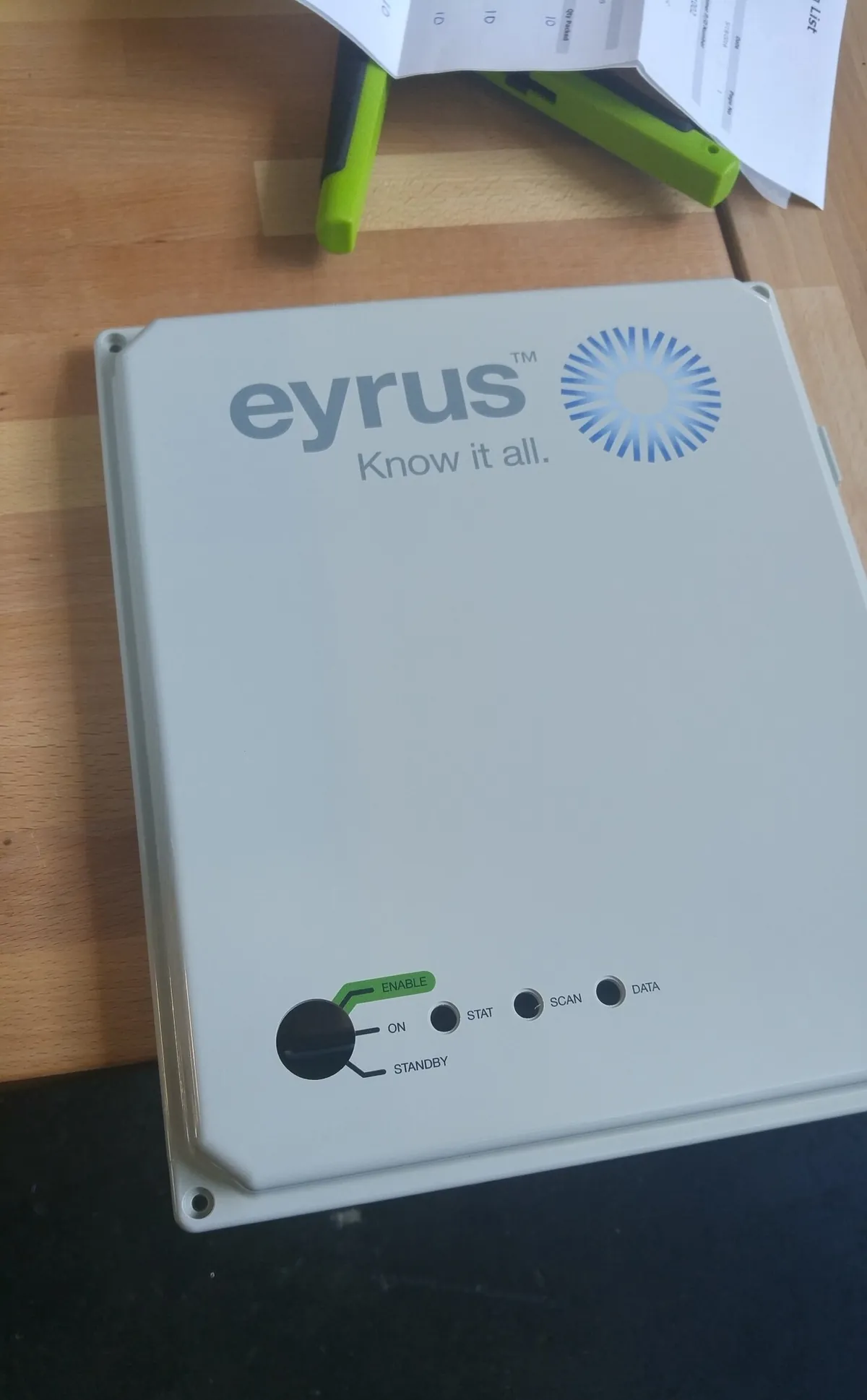 The front of a finished DCS enclosure: the Eyrus logo, a three-position switch reading Enable, On and Standby, and three lights labelled Stat, Scan and Data
