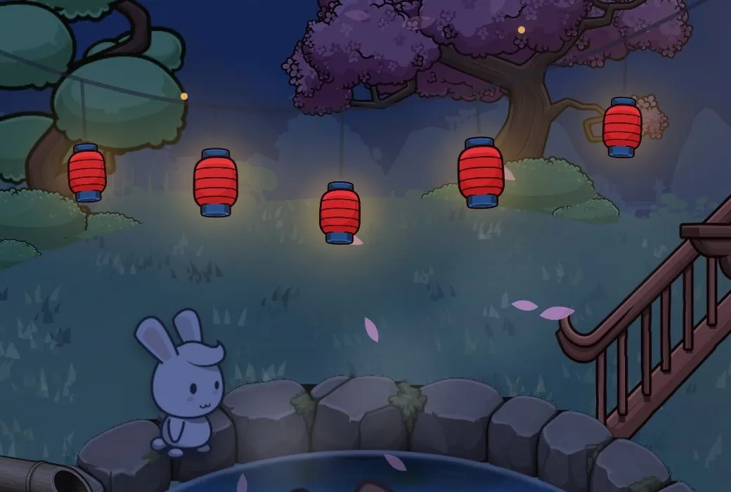 The same close-up at night: the trees and rabbit turn deep blue, and the red lanterns glow.