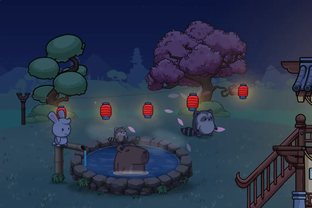 The hot spring at night: everything cools to deep blue, and the red lanterns glow.