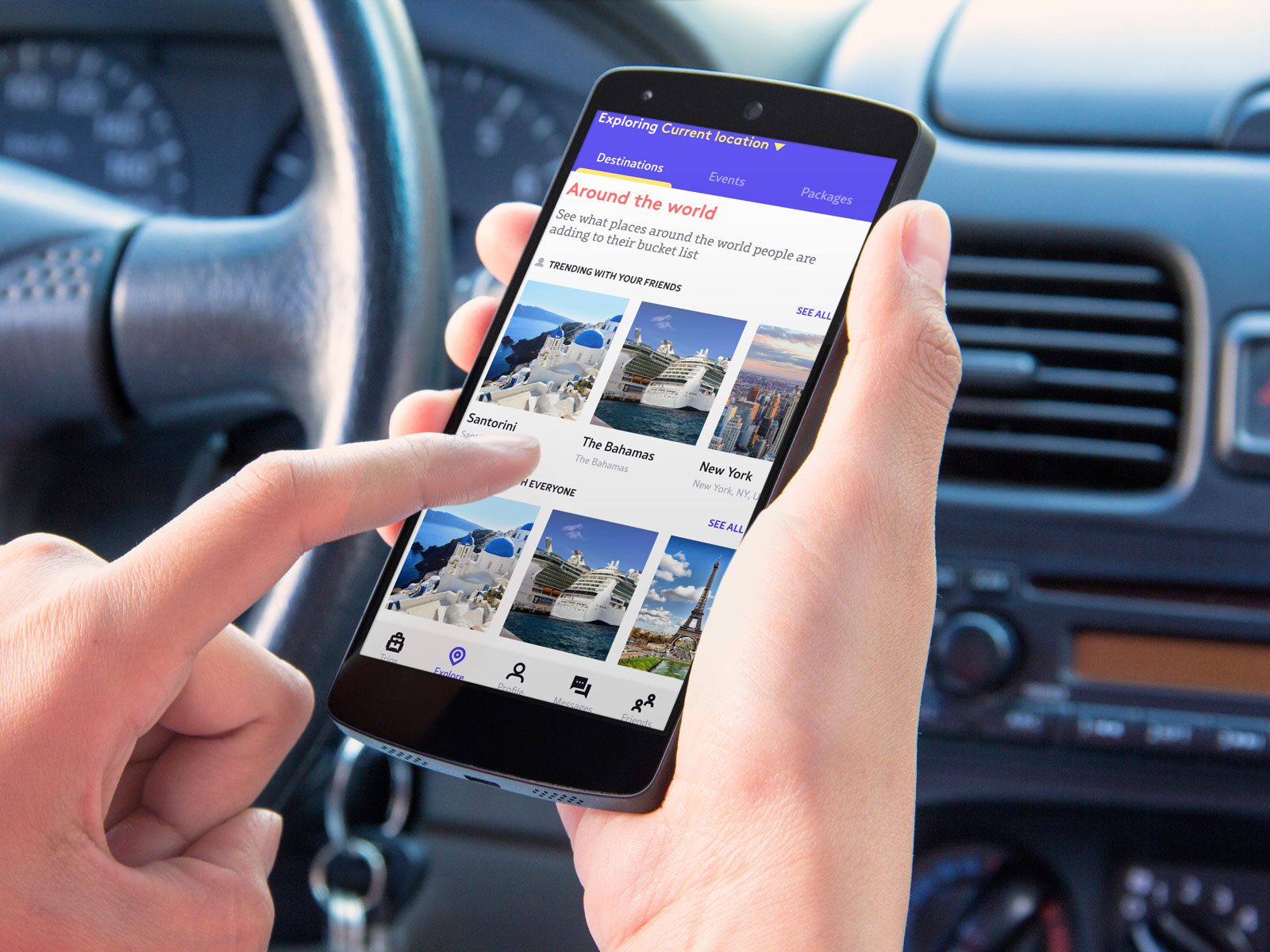 The Guzo app on a phone held in a car